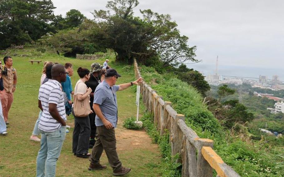 MCCS tour guide Chris Majewski talks to the group of Sailors from USNHO about the battle at Hacksaw Ridge.